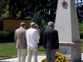 Standing before the Memorial and the wreath